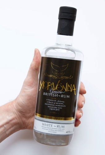 Morvenna White Rum bottle being held by a hand