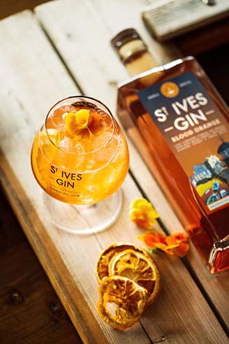 St Ives Blood Orange drink with bottle lying down
