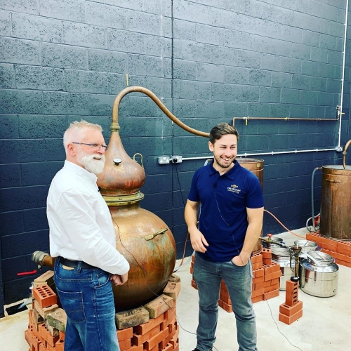 Trevethan Distillery - 2 men standing infront of a copper still