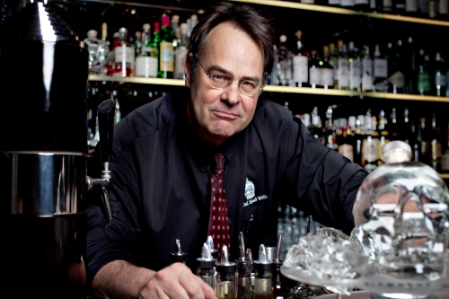 Dan Aykroyd - Crystal Skull Head Vodka Founder behind a bar