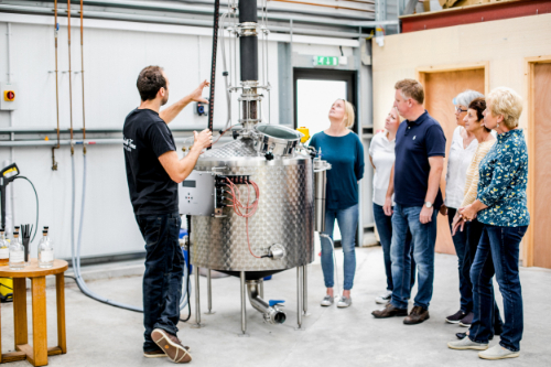 Steve giving a Colwith Farm distillery tour to a group of people