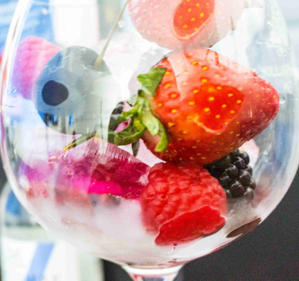 Glass with ice and fruitt close up
