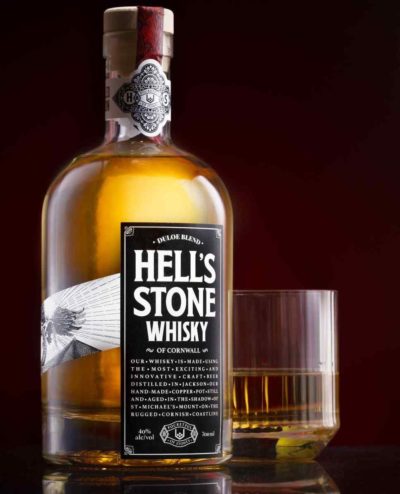 Hell's Stone whisky bottle with glass