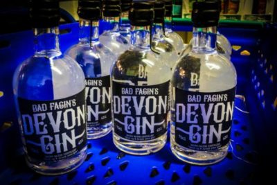 Bad Fagin's Devon Gin bottles in a blue plastic basket
