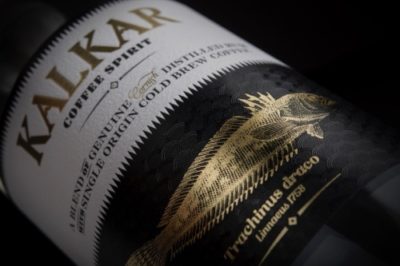 Close up of Kalkar Coffee Liqueur bottle label with a dark background