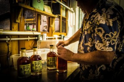 Rob Lothian adding a cork to Bad Fagins Apple Pie Moonshine