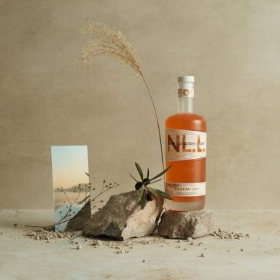 New London Light Aegean Sky on a rock with botanicals