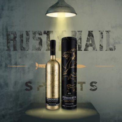 Penderyn Hiraeth bottle and tube on a Rusty Nail Grunge product backdrop with spotlight