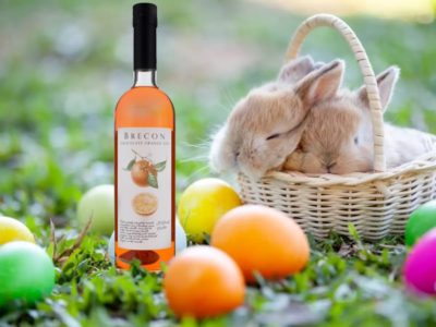 Brecon Chocolate Orange Gin with Easter Eggs and a basket full of sleeping bunnies