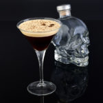 Crystal Skull Head Vodka bottle with an Espresso Martini in the foreground